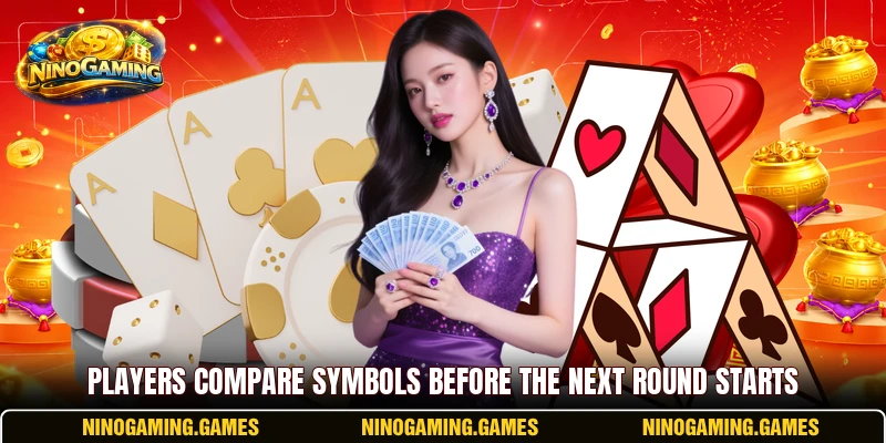 Players compare symbols before the next round starts Players compare symbols before the next round starts